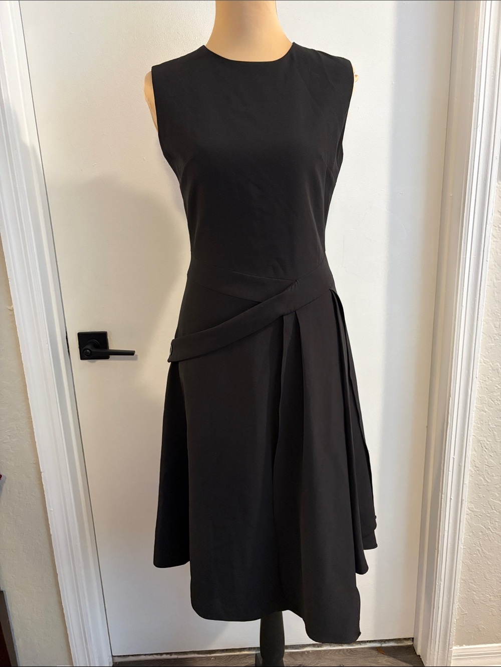 Few Moda black sleeveless dress interesting details at waist unique size small